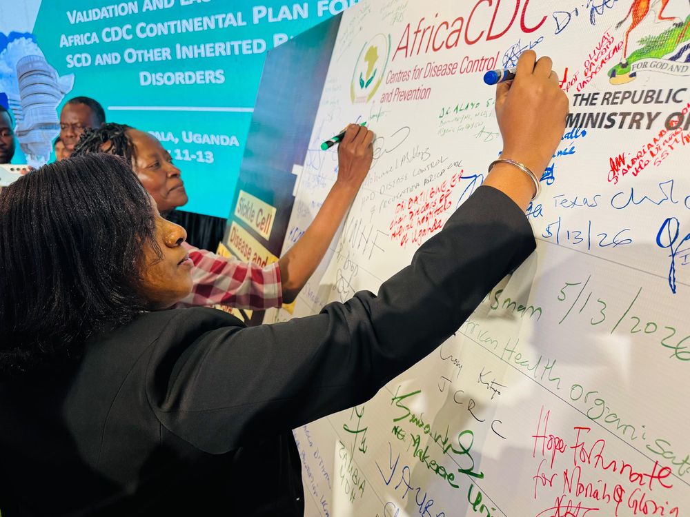 MHS representative signing the Africa CDC continental commitment board